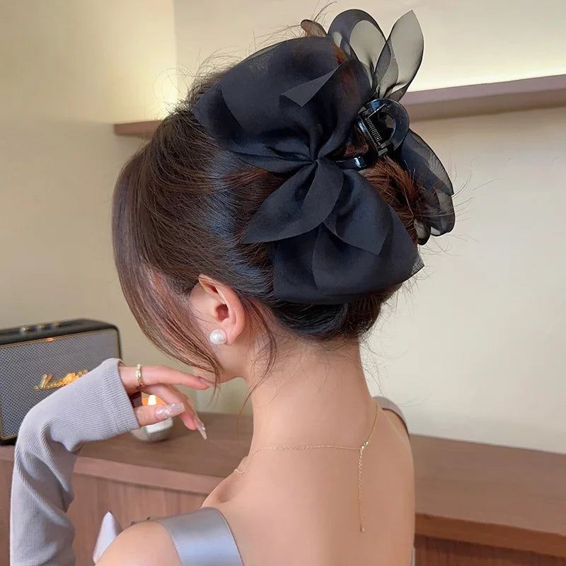 Mesh bow grab clip large hair clip shark clip headpiece on the back of the woman's head