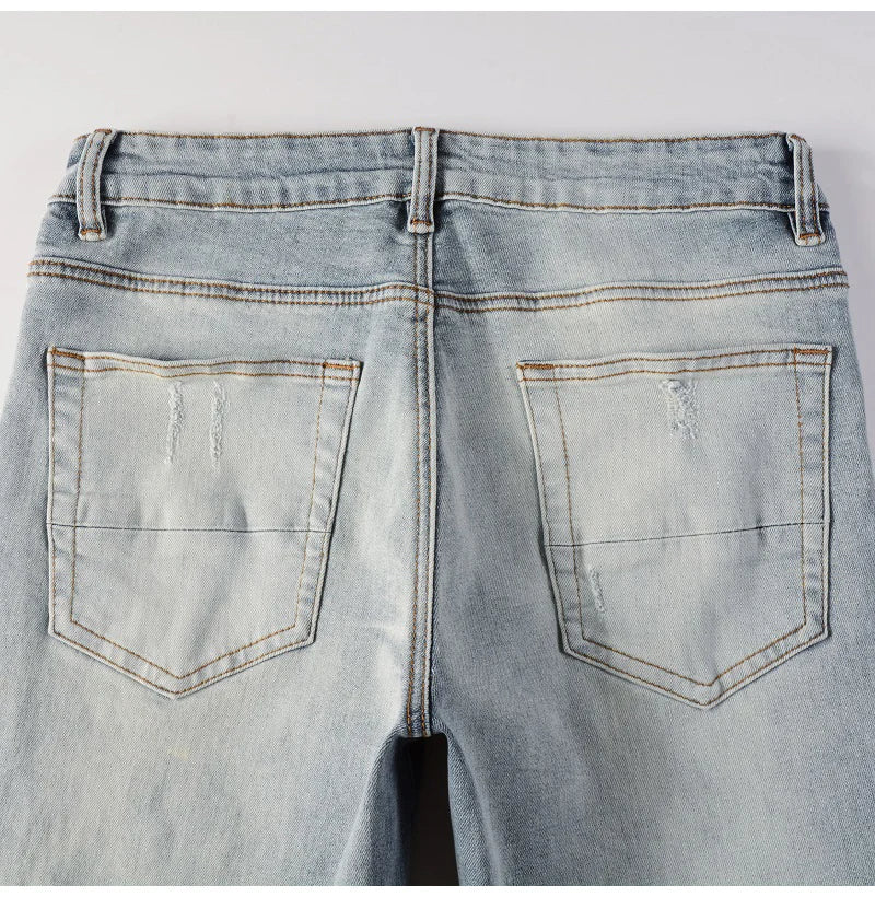 Men Leather Patches Denim Jeans Streetwear Holes Ripped High Stretch Pants Light Blue Skinny Tapered Trousers