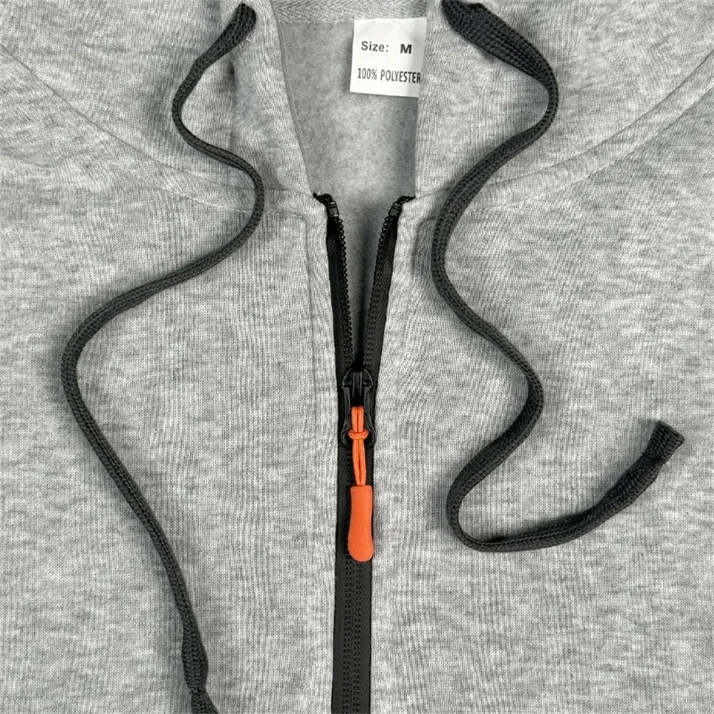 A two-piece outdoor fashion jogging and fitness set for men in autumn and winter, featuring a hooded sweatshirt and casual pants