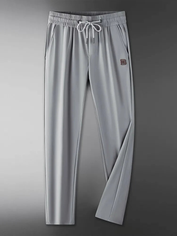 High end brand men's fashionable embroidered casual pants 2024 summer new cool silk breathable luxury solid color sports pants