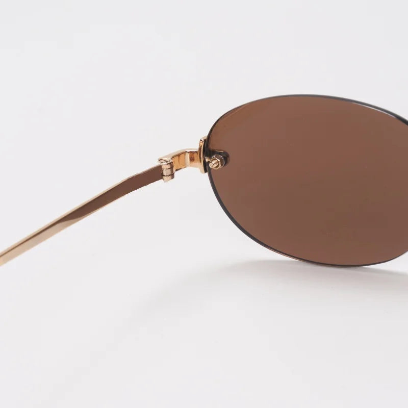 New frameless oval women's small glasses sunglasses brand designer fashionable luxury girls travel driving party sunglasses