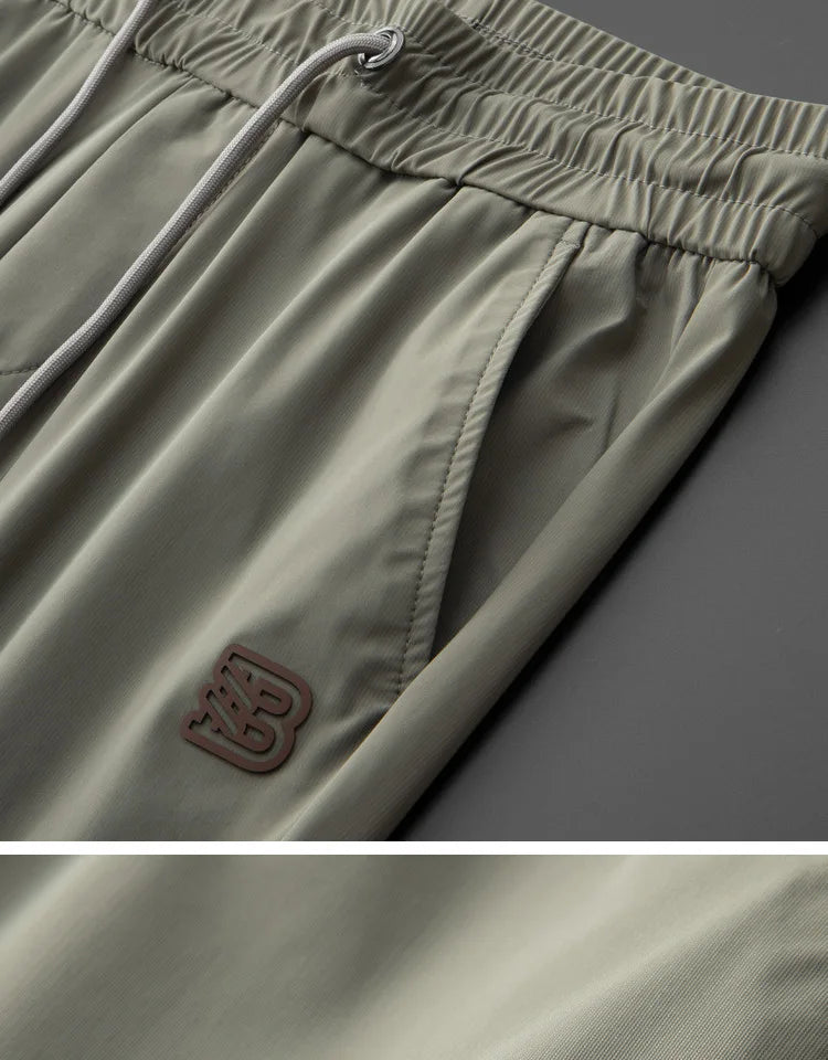 High end brand men's fashionable embroidered casual pants 2024 summer new cool silk breathable luxury solid color sports pants